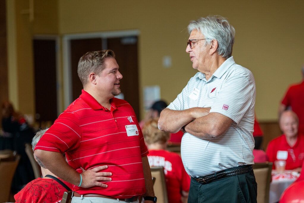 UWPharm-Tailgate_09172022_039 Tyler Prickette and Terry Maves in a conversation.