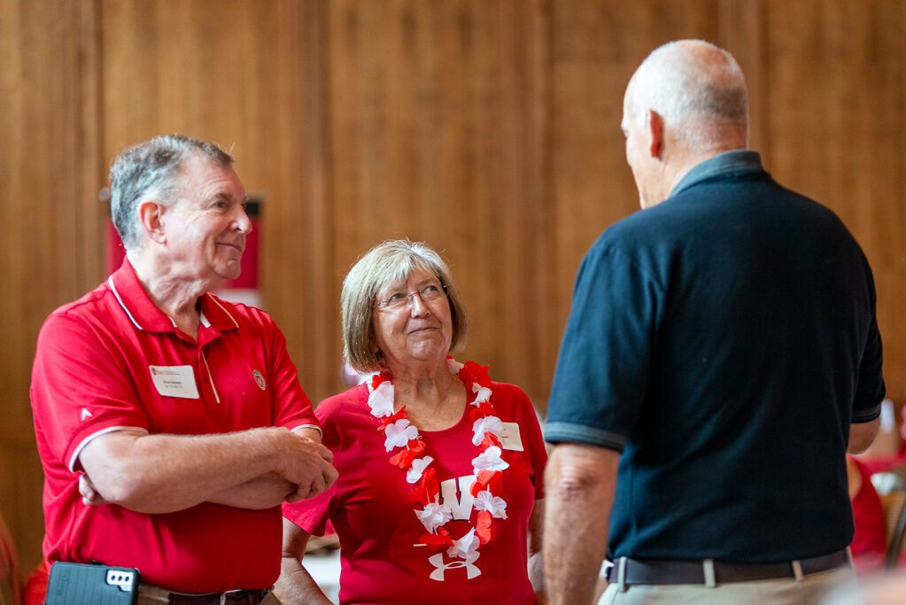 UWPharm-Tailgate_09172022_040 Russ and Sandra Jensen speak with Professor Paul Hutson.
