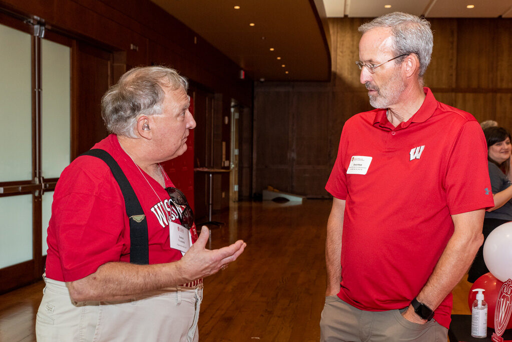 UWPharm-Tailgate_09172022_045 James Vosmek and Associate Dean for Advancement Dave Mott in a conversation.