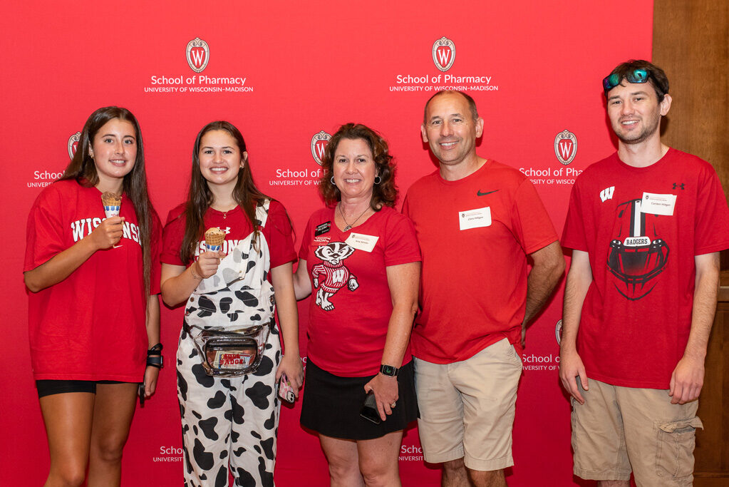 UWPharm-Tailgate_09172022_048 The Hitgen family smiles for a photo.