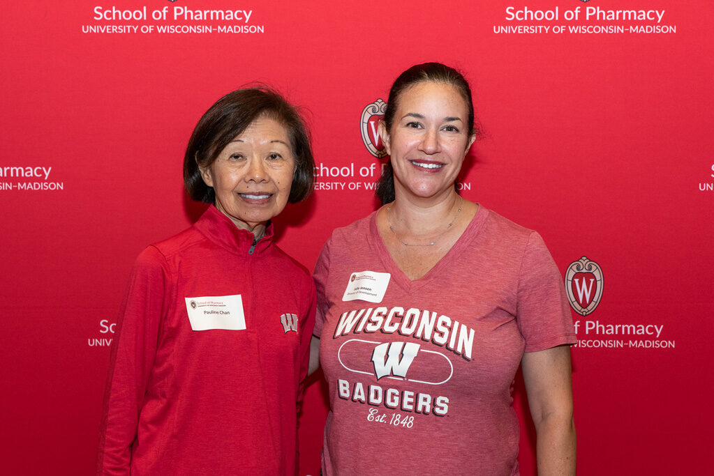 UWPharm-Tailgate_09172022_050 Pauline Chan and Director of Development Julie Jensen smile for a photo.