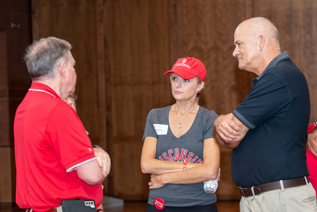 UWPharm-Tailgate_09172022_054 Professor Beth Martin, Professor Paul Hutson, and Russ Jensen engage in conversation.