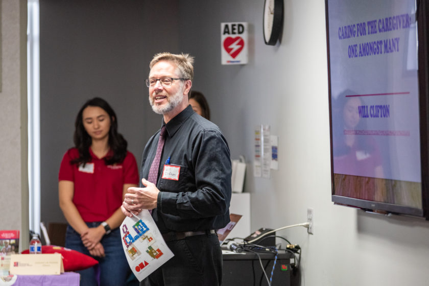 Man speaking at front of the room