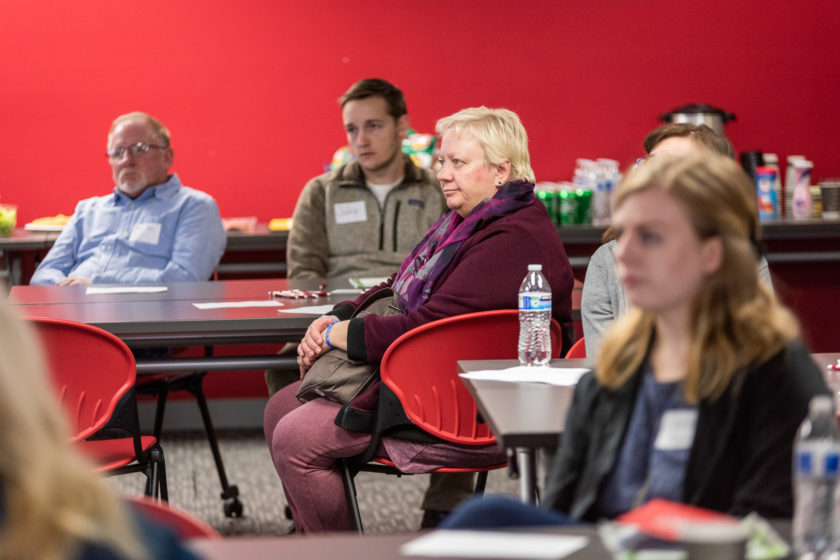 Attendees sitting around table for caregiver training event