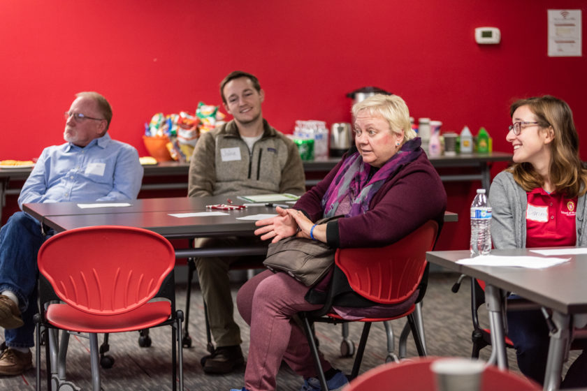 Attendees sitting around table for caregiver training event