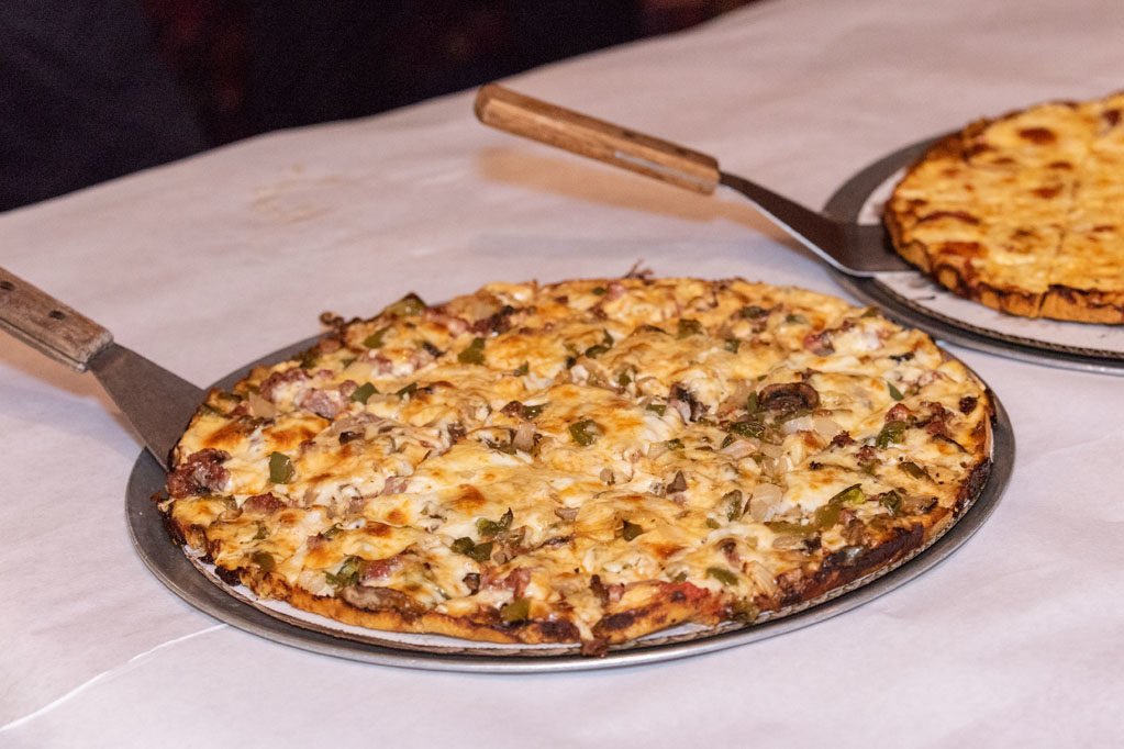 Pizzas laying on table for event