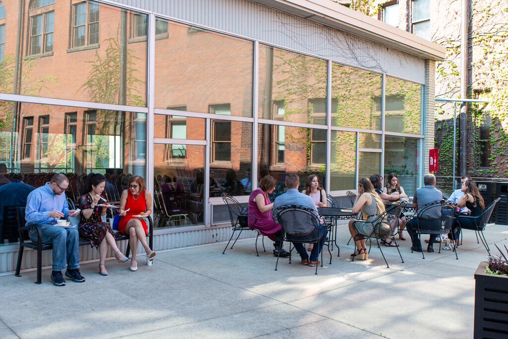 UWPhrmAward_2022_004 People eating outdoors at tables and benches