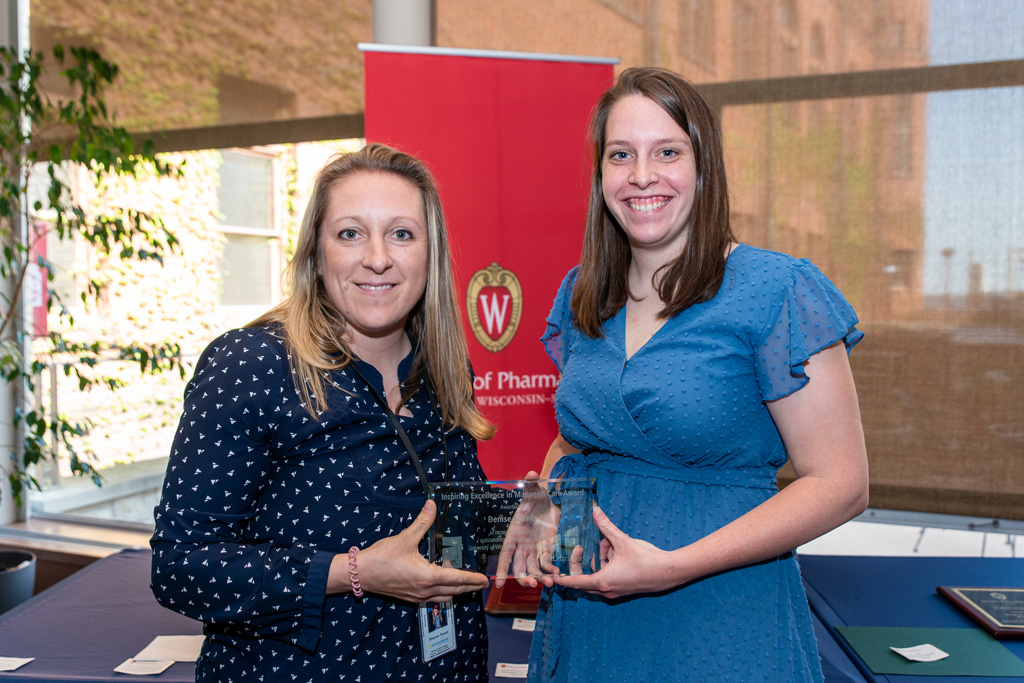 UWPhrmAward_2022_054 UW Pharm Award recipient holding their award