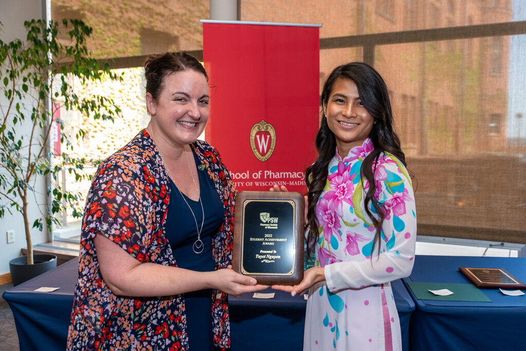 UWPhrmAward_2022_060 UW Pharm Award recipient holding their award