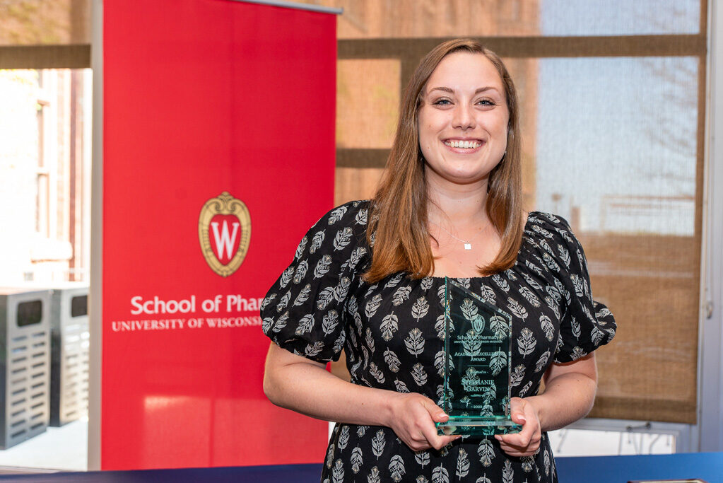 UWPhrmAward_2022_075 UW Pharm Award recipient holding their award
