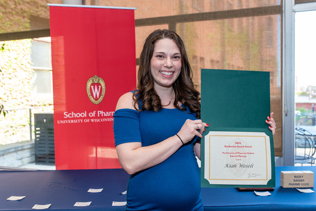 UWPhrmAward_2022_084 UW Pharm Award recipient holding their award