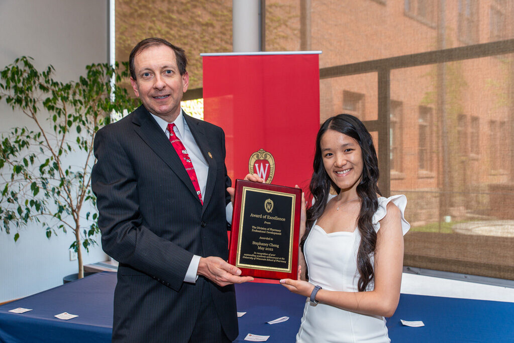 UWPhrmAward_2022_087 UW Pharm Award recipient holding their award