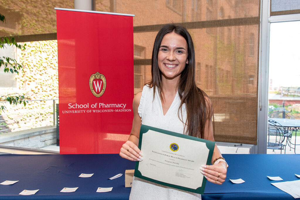UWPhrmAward_2022_099 UW Pharm Award recipient holding their award