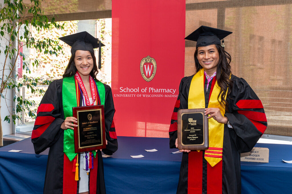 UWPhrmAward_2022_124 Graduated students holding up their UW Pharm awards