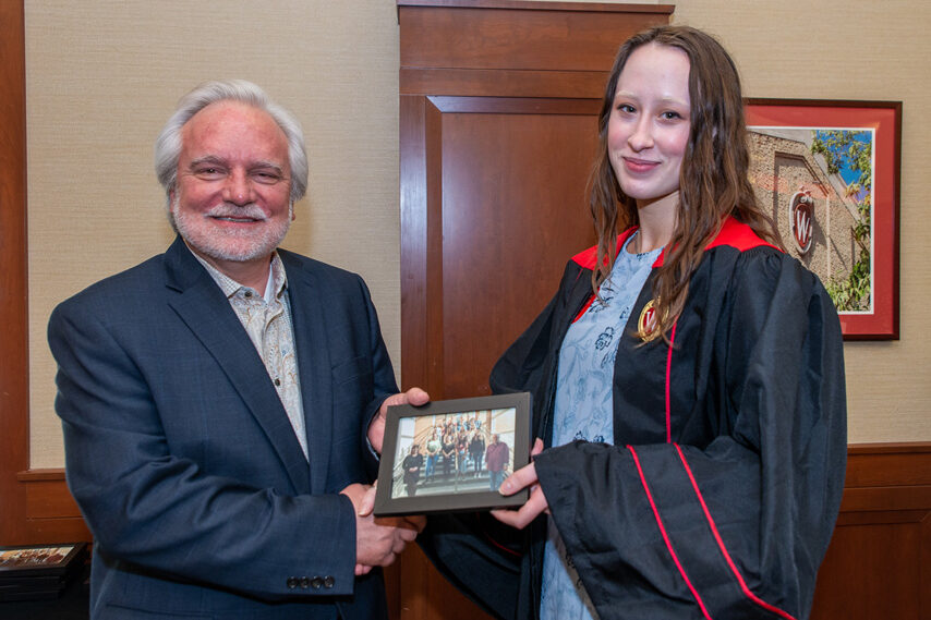 UWPhrmToxAw_2022_111 Graduate student holding a picture frame with prof. Jeffrey Johnson
