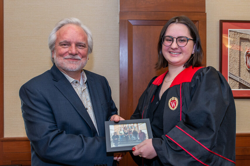 UWPhrmToxAw_2022_118 Graduate student holding a picture frame with prof. Jeffrey Johnson