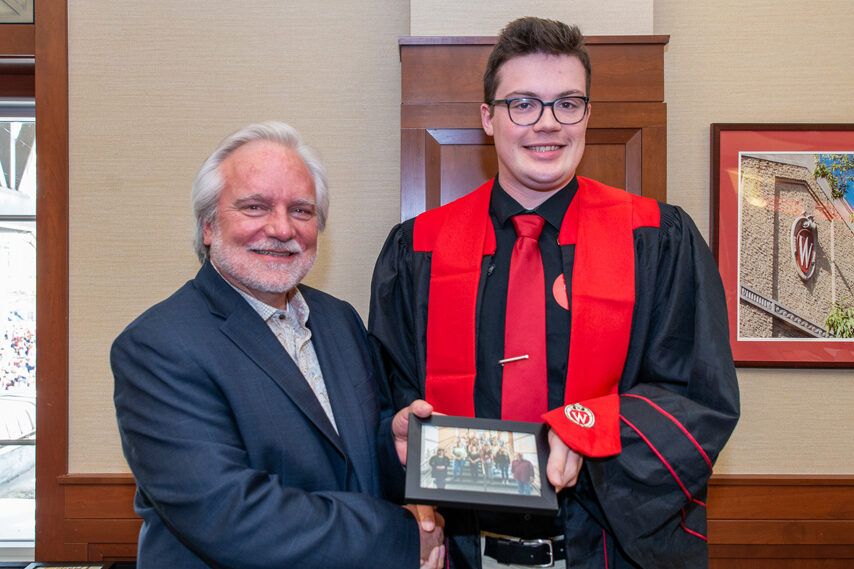 UWPhrmToxAw_2022_121 Graduate student with Prof. Jeffrey Johnson holding a picture frame
