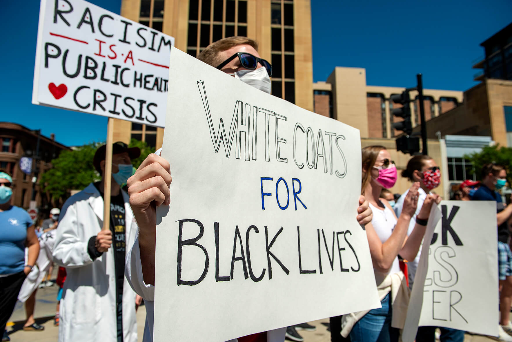 WC4BL_0620_DSC6794 Close up on student holding sign reading "White coats for Black Lives"