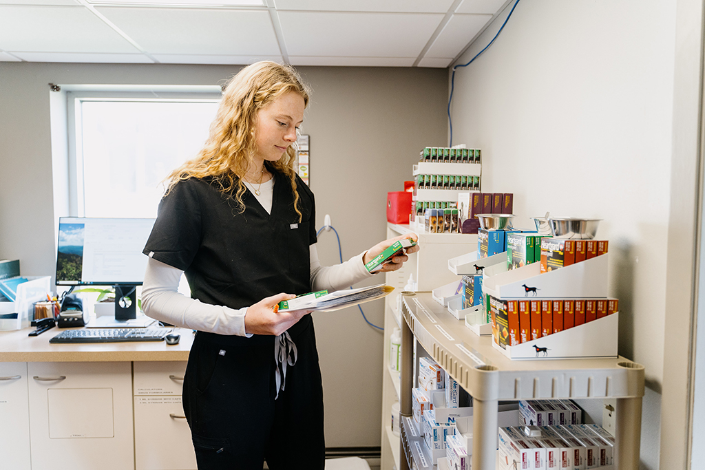 Sydney Weise selects the appropriate heartworm medication.