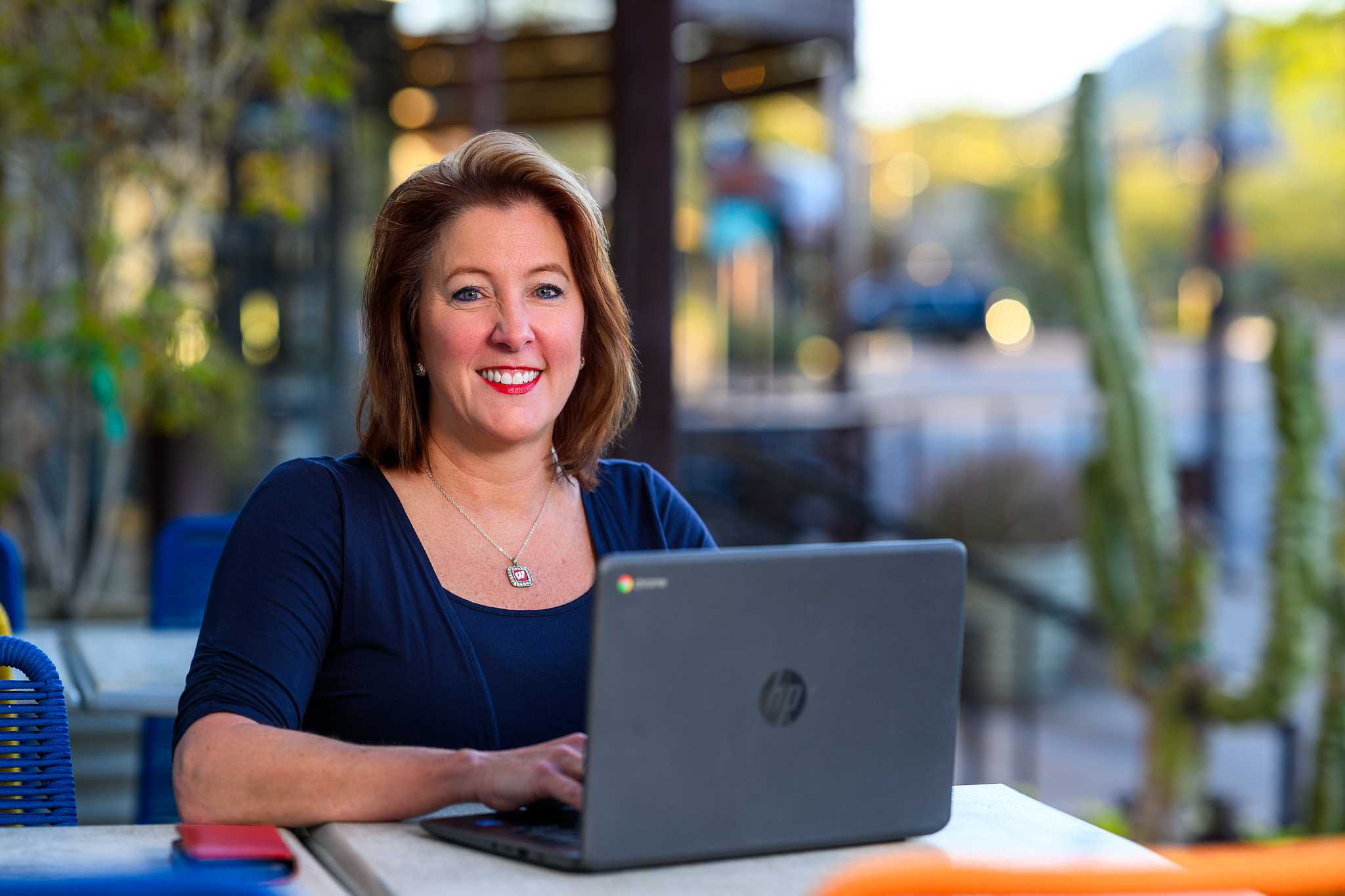 Joanne Palermo works at her laptop and smiles