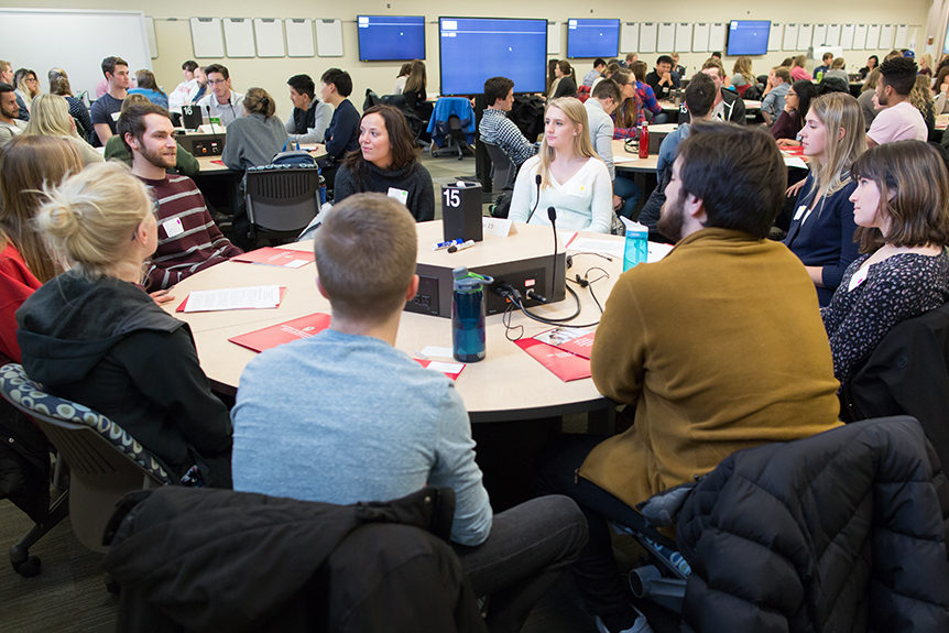 phar040218_014 Students working on an interprofessional teamwork activity.