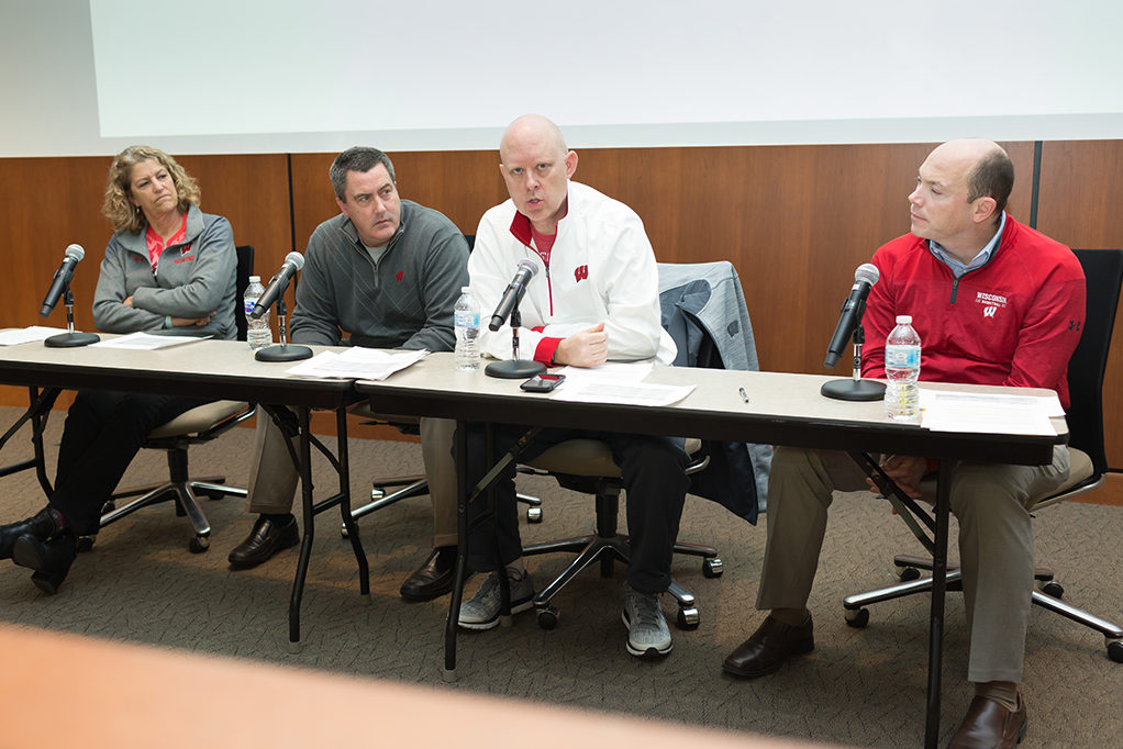 phar040918_002 Bebe Bryans (women's rowing), Paul Chryst (football), Kelly Sheffield (volleyball), and Jonathan Tsipis (women's basketball) speaking on panel