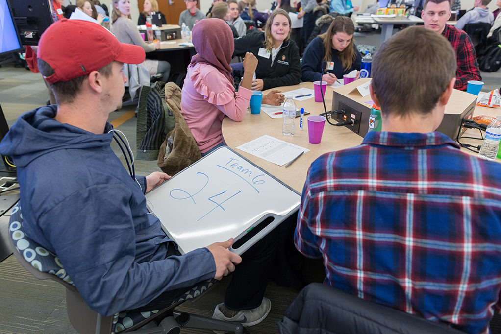 phar040918_018 Students working on an interprofessional teamwork activity.