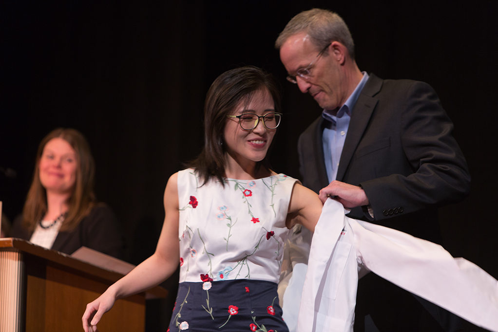 phar041419_019 Students dress with the white coat to symbolize the achievement they have at the School.