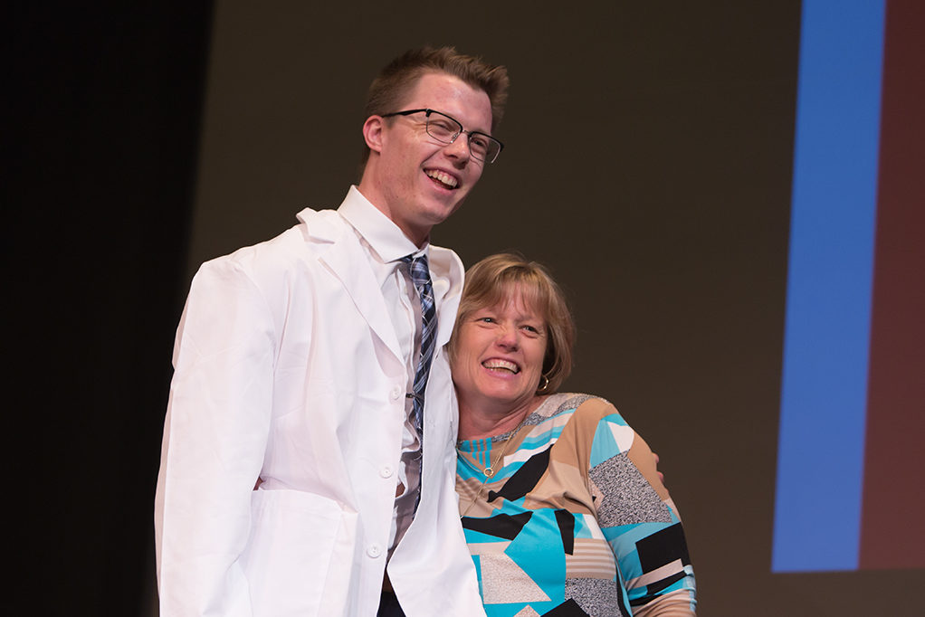 phar041419_021 Students dress with the white coat to symbolize the achievement they have at the School.