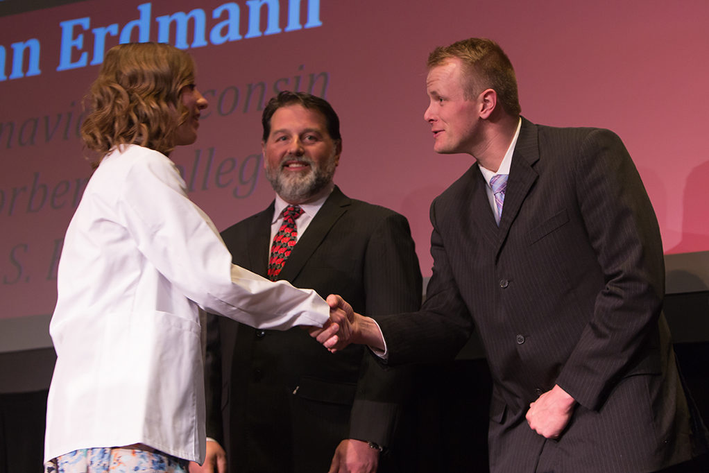 phar041419_025 Students dress with the white coat to symbolize the achievement they have at the School.