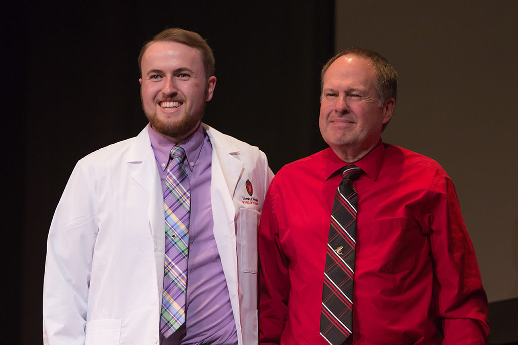 phar041419_034 Students dress with the white coat to symbolize the achievement they have at the School.