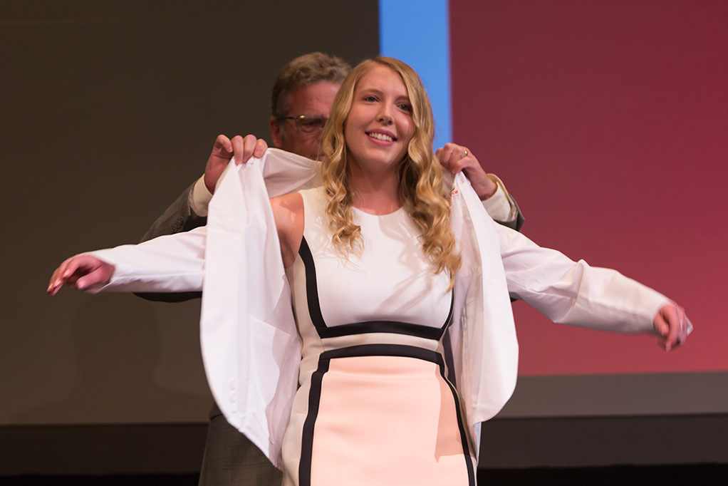 phar041419_047 Students dress with the white coat to symbolize the achievement they have at the School.