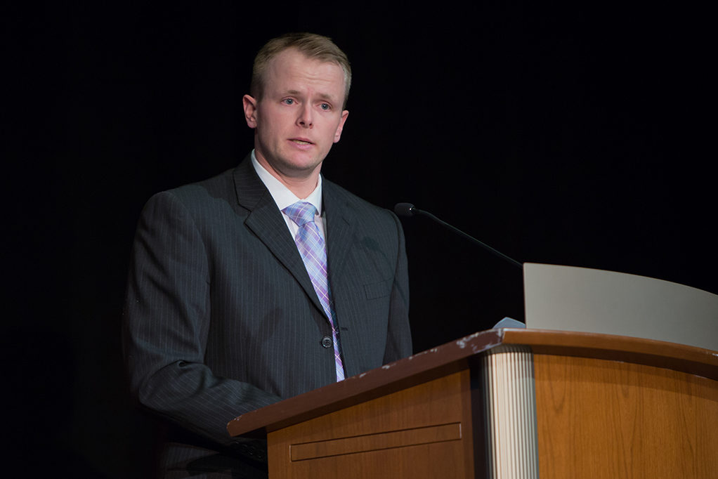 phar041419_083 Nathaniel Smith, president of Pharmacy Alumni Association, gives his message to the class as an alumnus.