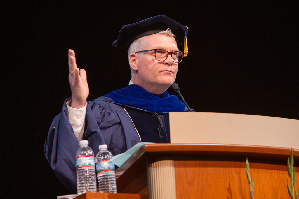 phar051019_113 Richard Bertz, alumni of the School, delivers his message to encourage the graduates.