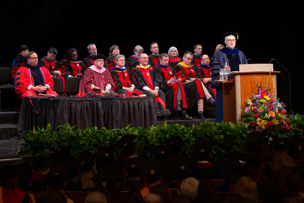 phar051019_115 School faculty are with students at the ceremony.