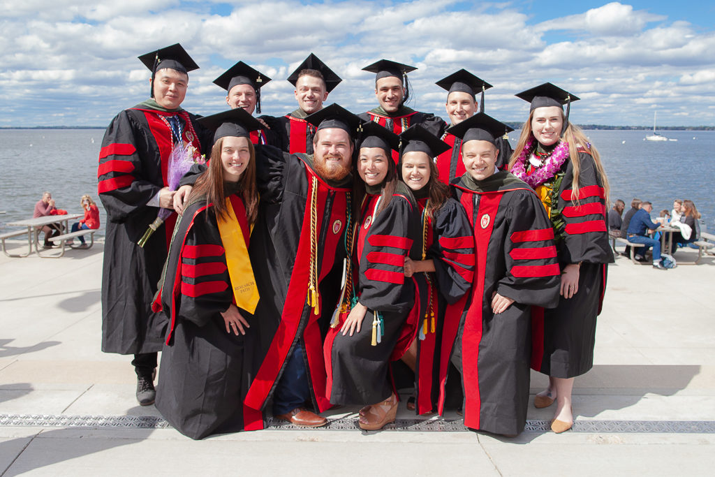 phar051019_155 Students celebrate the moment with a group photo of everyone in their graduation robes
