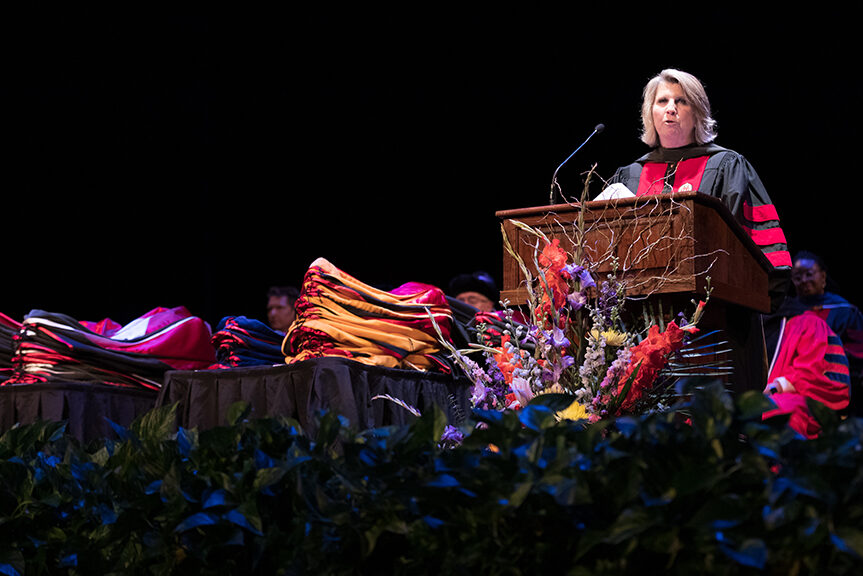 Deb Fluno speaks at the podium.