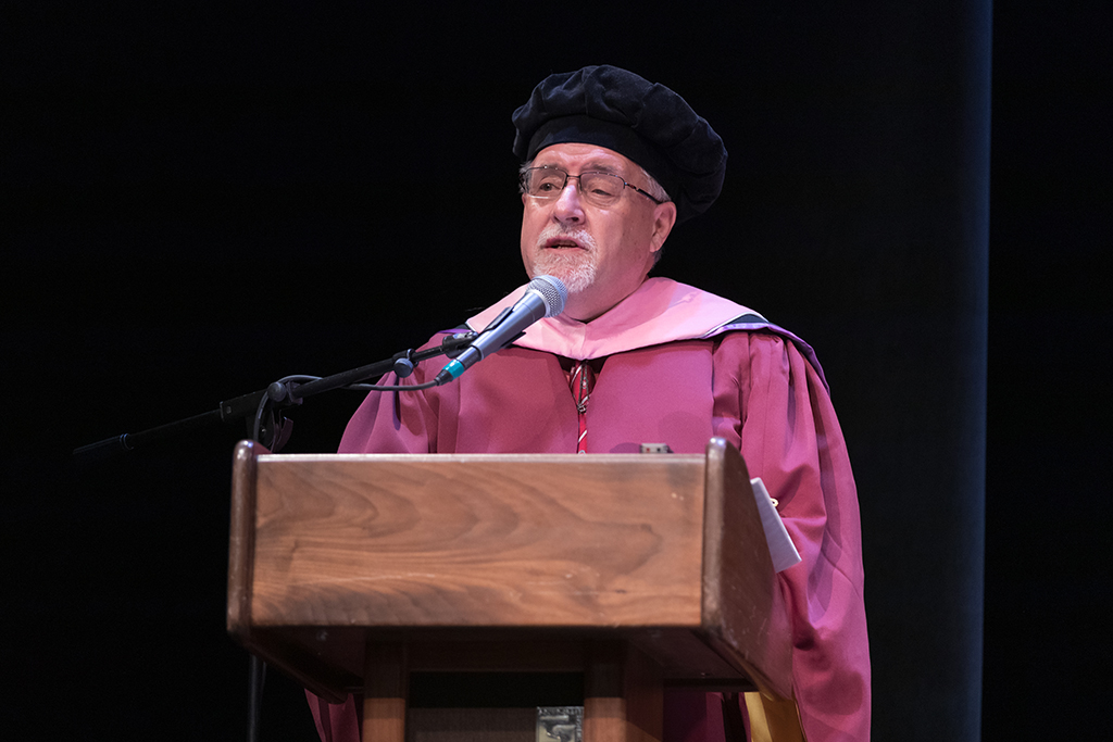 Assistant Dean Melgardt deVilliers speaks at the 2022 School of Pharmacy Hooding