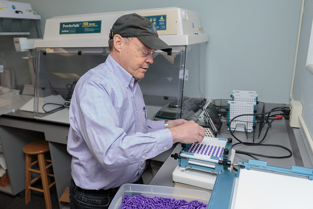 phar052218_042 Jeff Langer working with purple pills