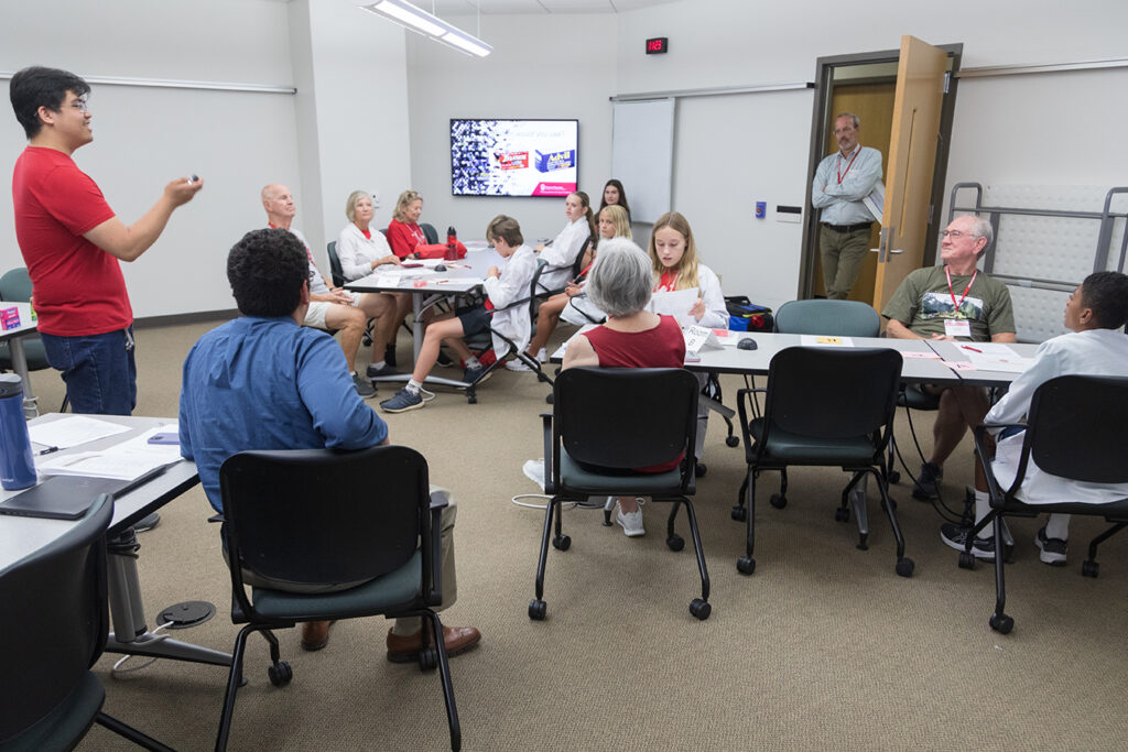 SoP Grandparents University 2023 A room of attendees listen as a student ambassador speaks