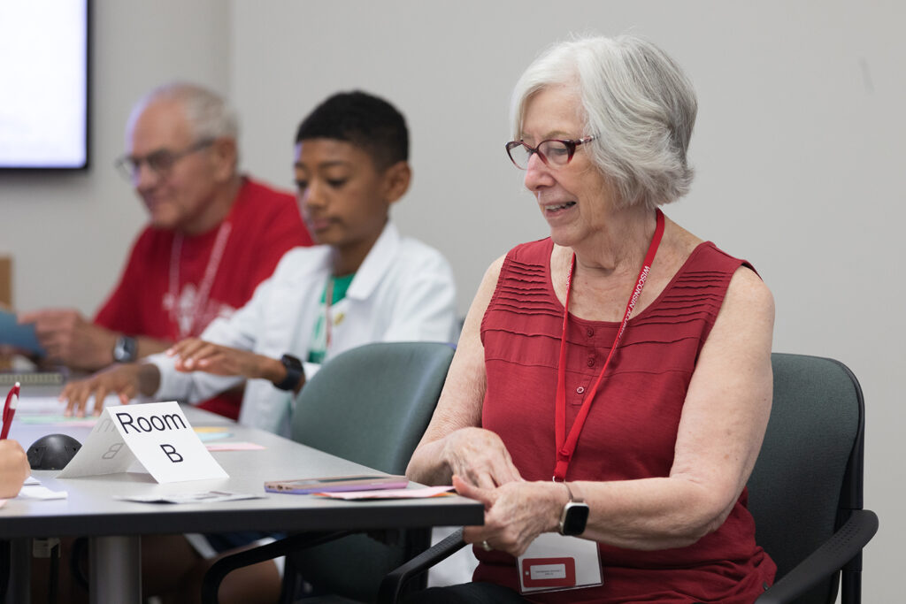 SoP Grandparents University 2023 An older attendee seated at a table