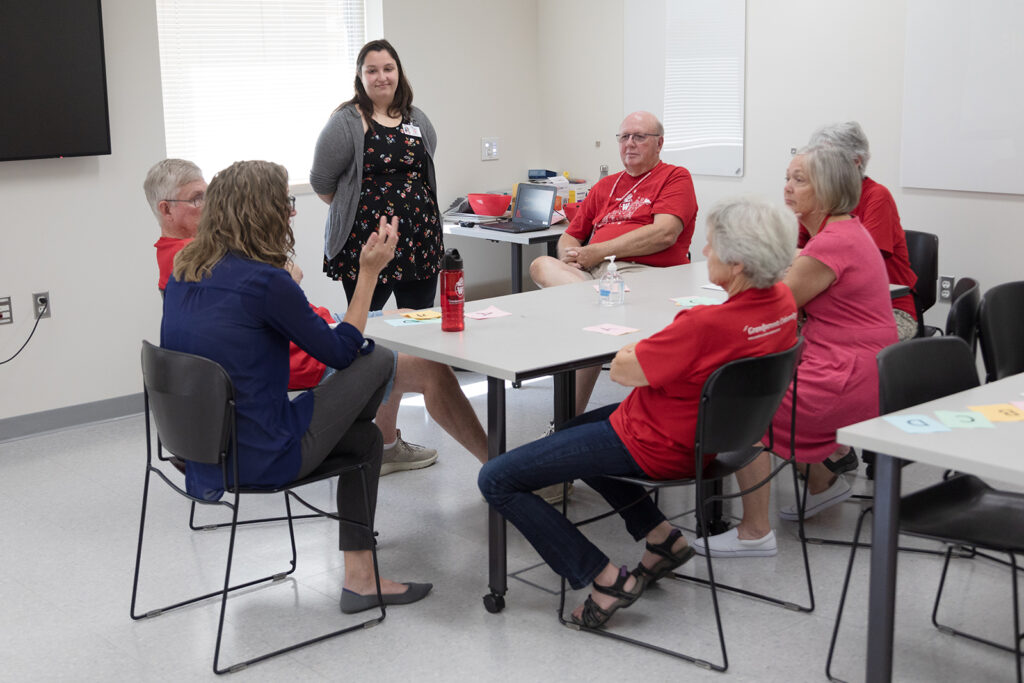 SoP Grandparents University 2023 A group of attendees sit at a small table