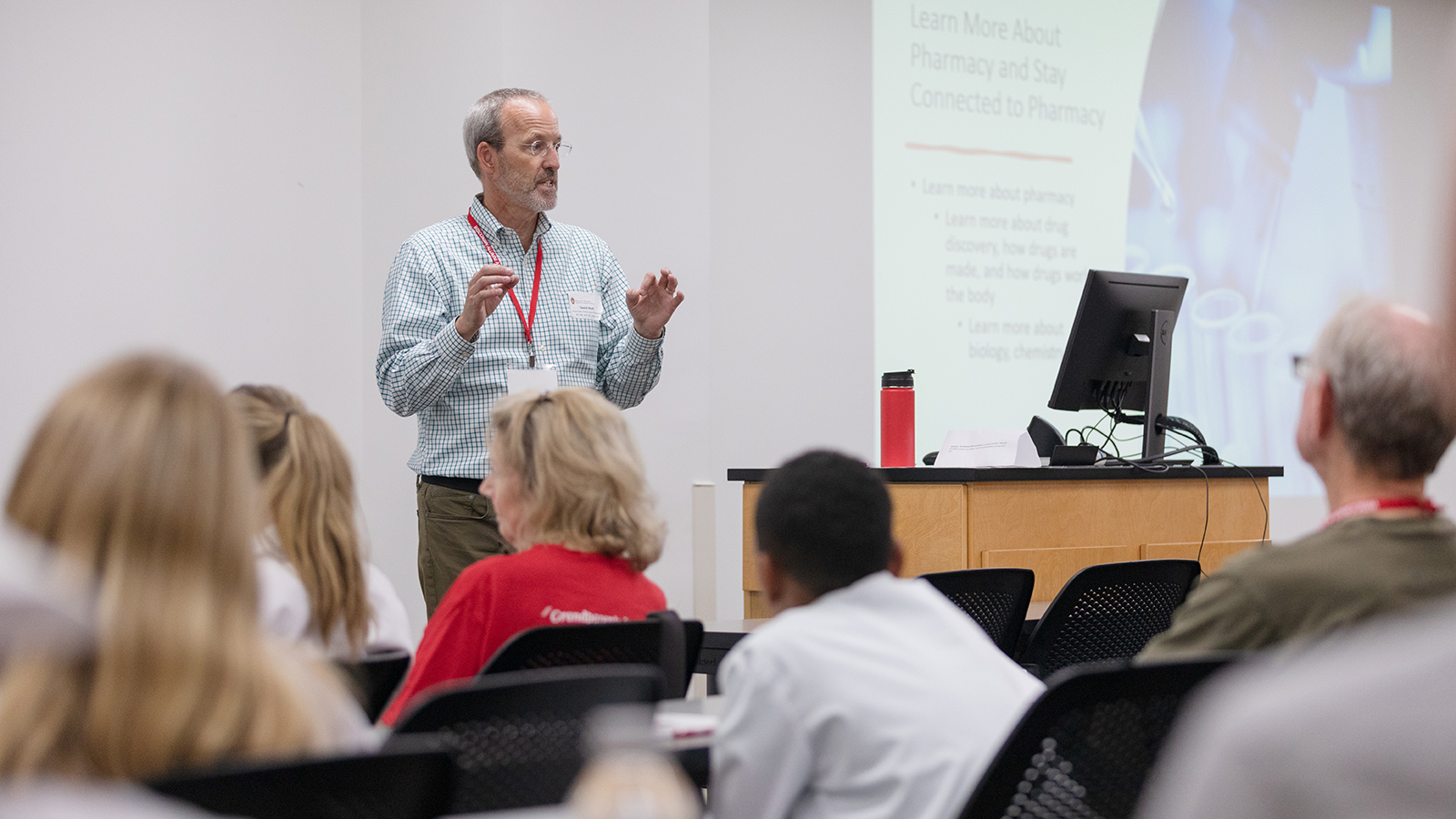 Professor Dave Mott speaks in front of the 2023 Grandparents University group.