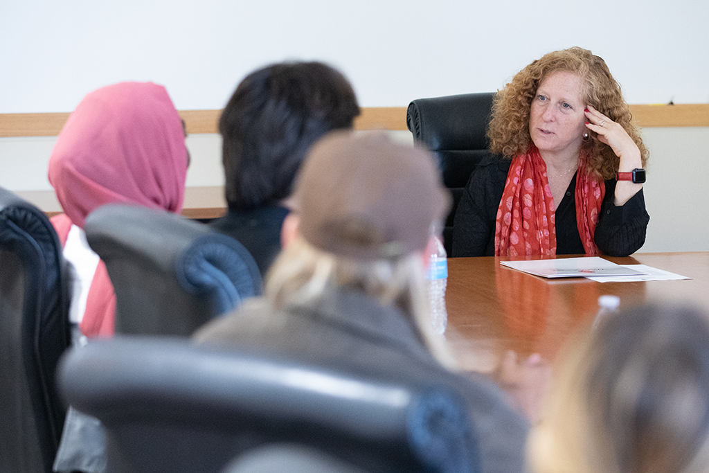 Chancellor Mnookin talking with staff in a conference room