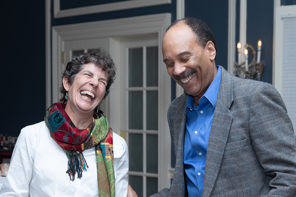 UW School of Pharmacy 2022 Citations of Merit Dinner & Awards Susan Stein and a gentleman laugh.
