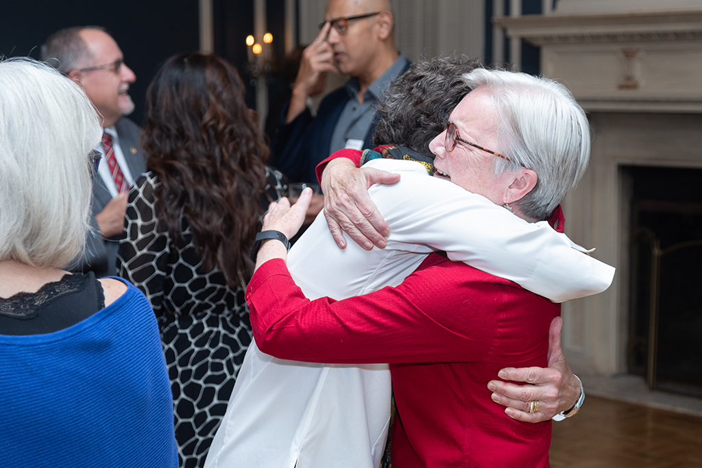 UW School of Pharmacy 2022 Citations of Merit Dinner & Awards Susan Stein and Jeanette Roberts embrace.