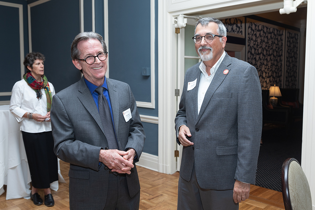 UW School of Pharmacy 2022 Citations of Merit Dinner & Awards John Swann and Greg Higby smile at the camera.