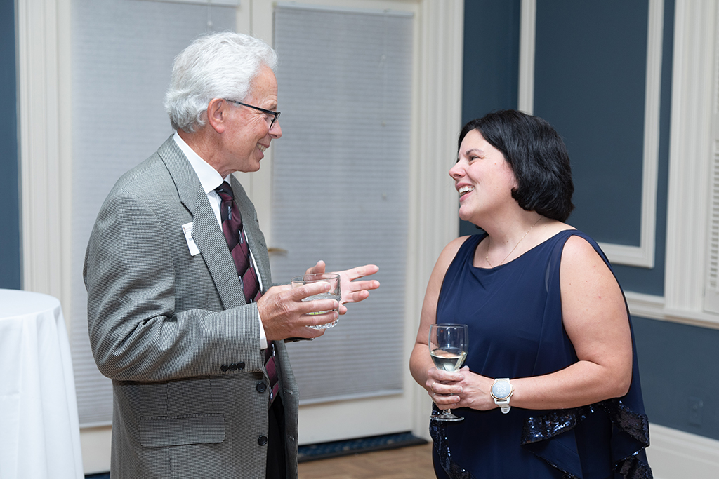UW School of Pharmacy 2022 Citations of Merit Dinner & Awards Michelle Farrell speaking with Bob Breslow.