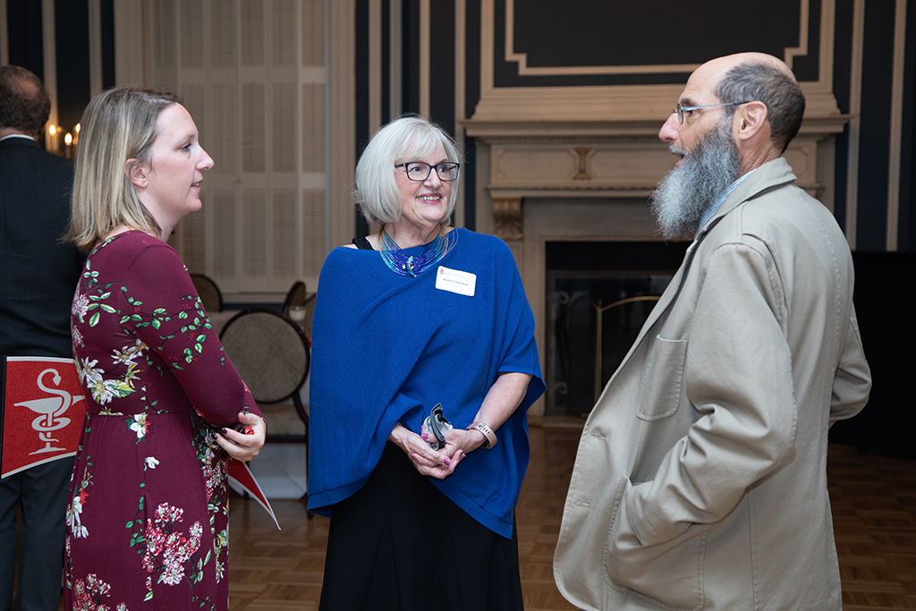 UW School of Pharmacy 2022 Citations of Merit Dinner & Awards Bonnie Fingerhut and Dan Stein speak with another attendee of the Citations dinner.
