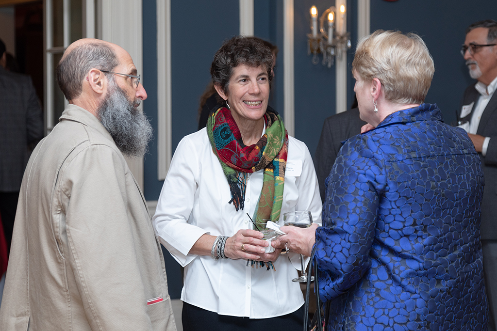 UW School of Pharmacy 2022 Citations of Merit Dinner & Awards Susan Stein and her husband speak with Karen Kopacek.